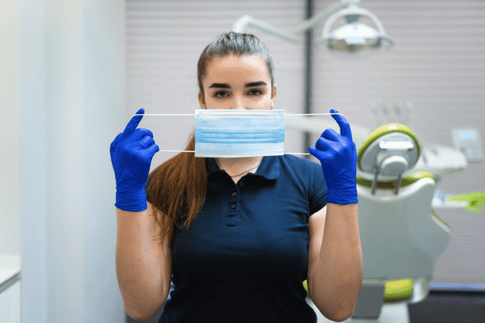 dentist holding face mask