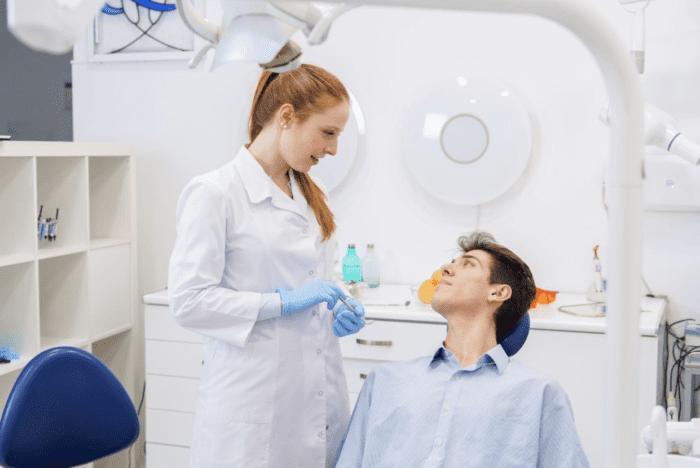 dentist talking to patient