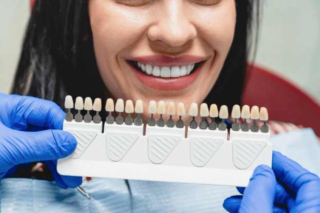 dentist showing woman veneers