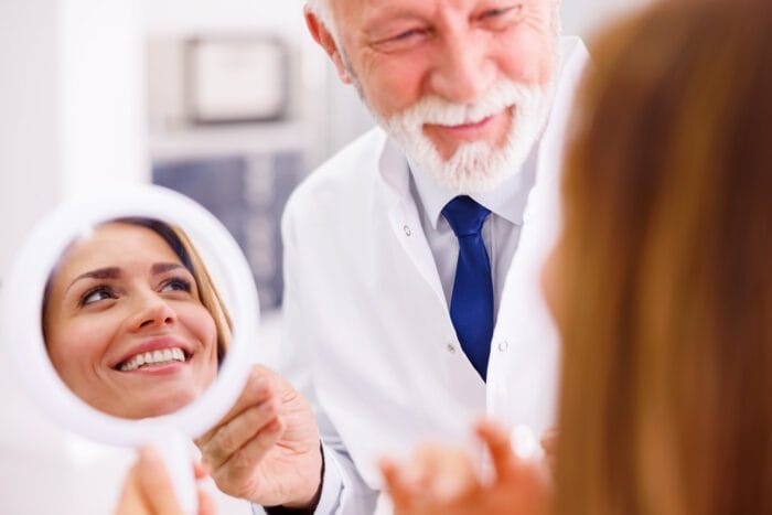 Dentist and patient at dental clinic