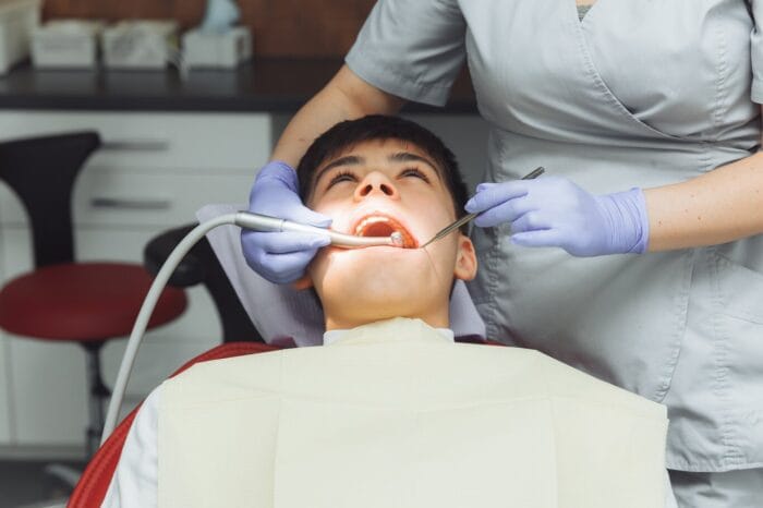 dentist performing gum disease treatment