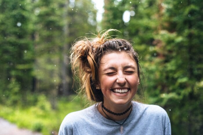 woman smiling with eyes closed