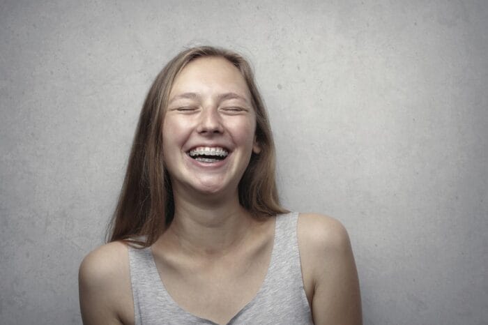 woman with braces laughing